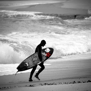 _DSC7009.JPG Nuno exiting the water in full hood with his 5`5 Lost RNF Aviso